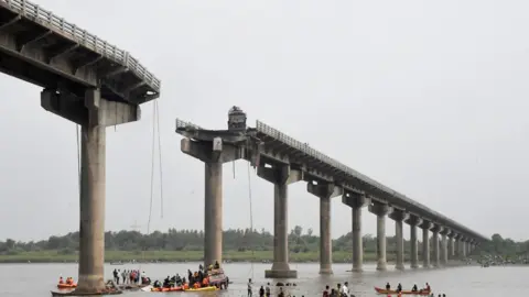 Reuters Rescuers search for survivors after a bridge collapsed in Vadodara in the western state of Gujarat, India, July 9, 2025. REUTERS/Stringer