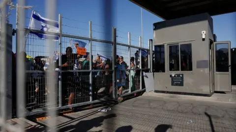 Reuters Protesters gather outside Sde Teiman detention facility after some of them broke in, after Israeli military police arrived at the site as part of an investigation into the suspected abuse of a Palestinian detainee, near Beersheba