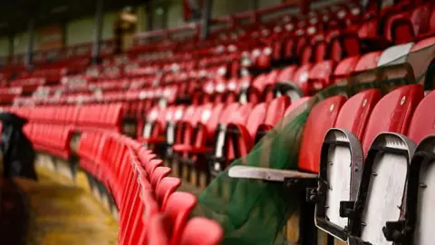 Getty Rows of red seats at the Brandywell stadium 