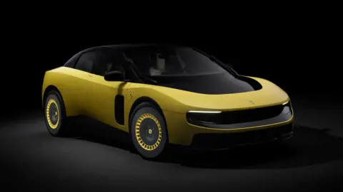 A promotional image of a yellow version of the electric Ferrari Luce, photographed in a dark studio.