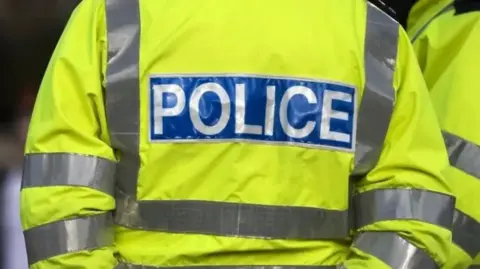 Getty Images The back of a police hi vis uniform.