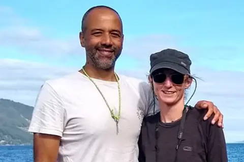 Survivors inform BBC of terrifying escapes Tarig with his arm around Tarig with the sea in the background.