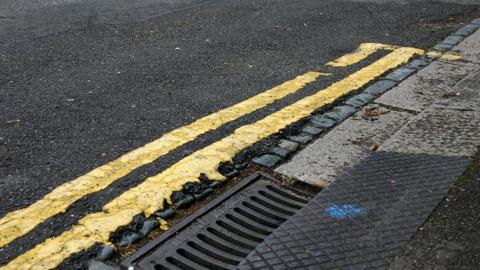 Double yellow lines on road