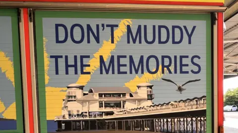 Avon Fire & Rescue Service A mural on a fire engine, with an image of Weston's famous pier behind it and the phrase "Don't muddy the memories" 