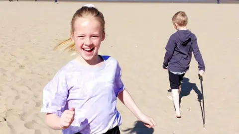 Lucy Thompson Harry and Eli on the beach 