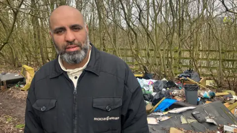 BBC Photograph of Faz Din, who lives near a fly-tipping hotspot in Tameside.