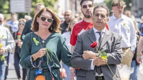 PA Media Emma Webber at a memorial in Nottingham last month