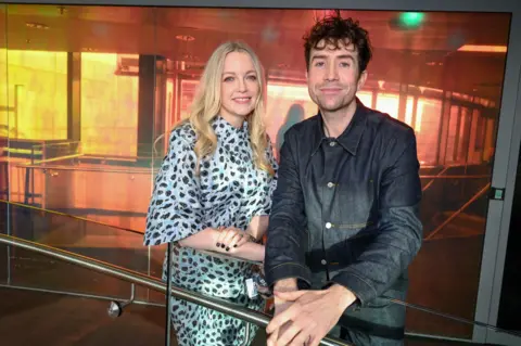 Sarah Jenyes / BBC Lauren Laverne poses with Nick Grimshaw at the BBC 6 Music studios 