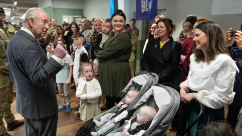 PA Media King Charles III meets with families of personnel serving abroad during a visit to the Royal Regiment of Artillery at Baker Barracks, Thorney Island, West Sussex. 