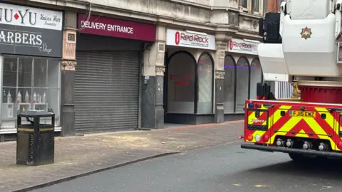 An image of broken bricks that fell on to a pavement in Belvoir Street in Leicester