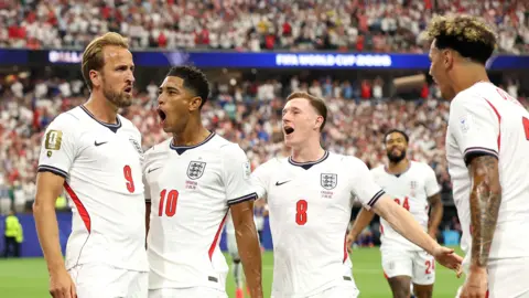 England's Harry Kane celebrates with team-mates after opening the scoring against Croatia