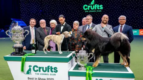 Getty Images Miuccia and Viking facing each other on the podiums