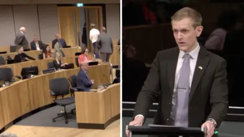 Left: Senedd members walking towards the door. Right: Joe Martin speaking at a lectern in the Senedd.