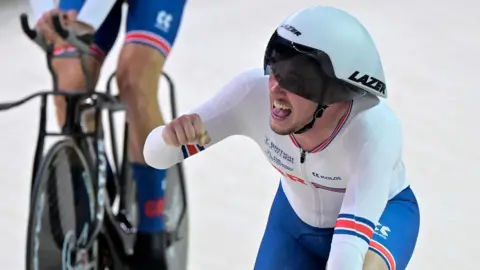 Britain's Rhys Britton celebrates after winning the men's team pursuit final bronze event of the European Championships Munich 2022 in Munich