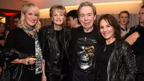 Getty Images Nicki Chapman is standing with Madeleine Lloyd Webber, Sir Andrew Lloyd Webber and Arlene Phillips. They attended a press night performance of School Of Rock The Musical at The New London Theatre in 2016.