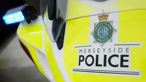 Merseyside Police Close up of the Merseyside Police logo on a police vehicle