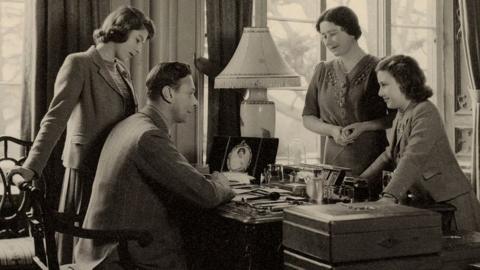 The Royal Family, in 1943, pictured around King George VI's desk