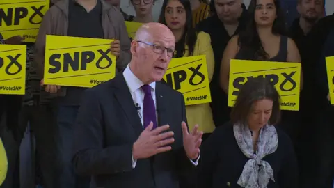 John Swinney speaking in Glasgow