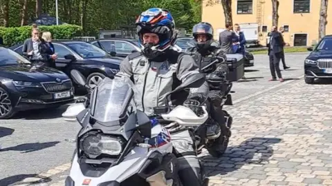 Petr Pavel/X Czech President Petr Pavel (pictured in front) rides a motocycle. Photo: May 2023