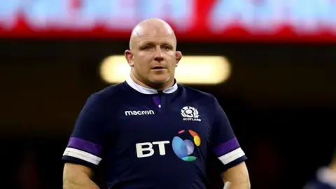 Scott Lawson on the pitch at the end of a Six Nations match for Scotland in 2018