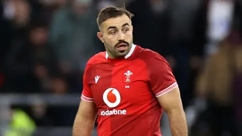 Liam Belcher in action for Wales at England