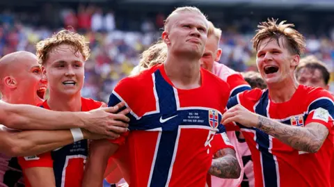 Erling Haaland of Norway celebrates his goal with teammates during the FIFA World Cup 2026 Round of 16 match between Brazil and Norway.