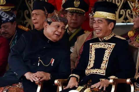 Reuters Prabowo Subianto talks with Indonesian President Joko Widodo