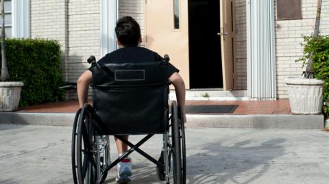 A boy using a wheelchair
