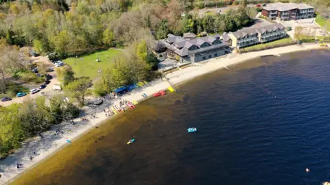 Turkey Red Media An overhead view of Loch Lomond and the shoreline.