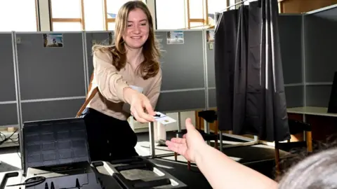 Belgian Crown Princess Elisabeth casts her vote at polling station during Belgian general, regional and European parliament elections in Laeken district of Brussels, Belgium, 09 June 2024