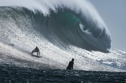 Nic Bothma / Reuters South African surfer Levi Kolnik rides a wave