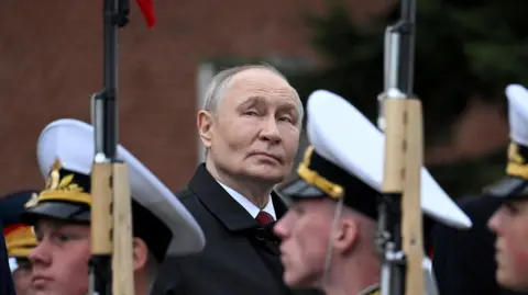 Reuters Russian President Vladimir Putin looks upwards during a ceremony in central Moscow, Russia, on 9 May 2026.