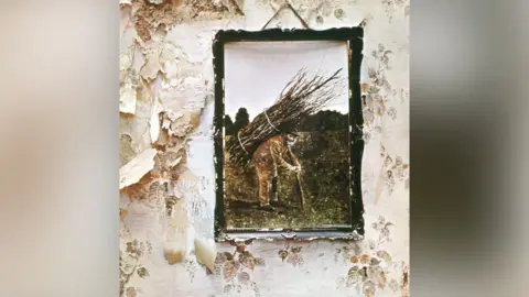 Getty Images / Michael Ochs Archives The album cover for Led Zepplin IV featuring a photo of a man with sticks on his back.