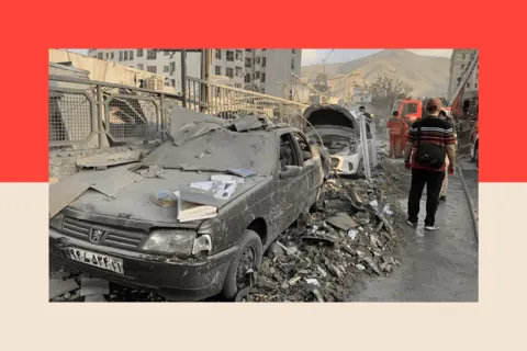 Getty Images A view of damaged vehicles in the Iranian capital, Tehran, following an attack, on 13 June 2025.