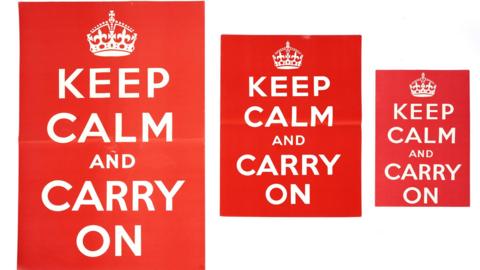 Three red posters of different size with the message "keep calm and carry on" in white letters
