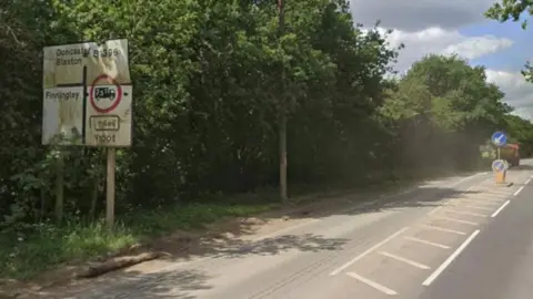 A road sign which provides directions for Blaxton and Doncaster.