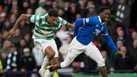 Celtic's Auston Trysty vies with Rangers' Djeidi Gassama