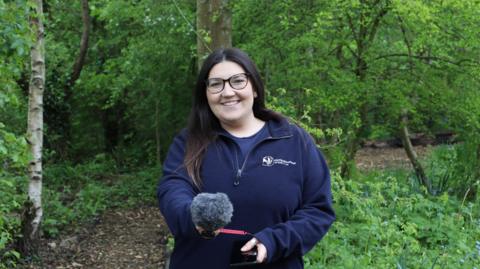 Natasha Hemsley from Northumberland Wildlife Trust holding a microphone