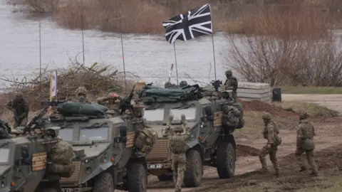British troops in Foxhound vehicles arrive after crossing of the Vistula River as part of the NATO Dragon 24 military exercise in Poland