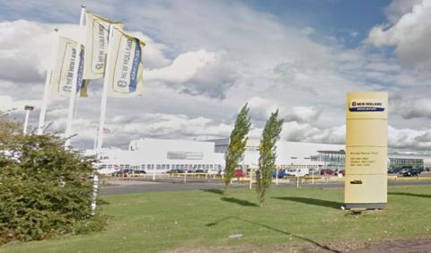 View of tractor factory in Basildon, with flags saying new Holland Agriculture blowing in the wind