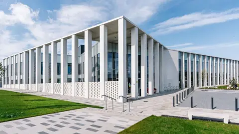 Inverness Justice Centre, a modern white building.
