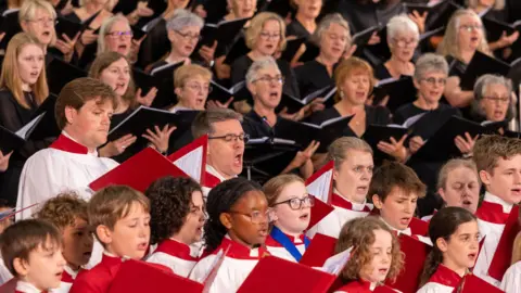 Dale Hodgetts A number of choristers singing together as part of a festival in Gloucester.