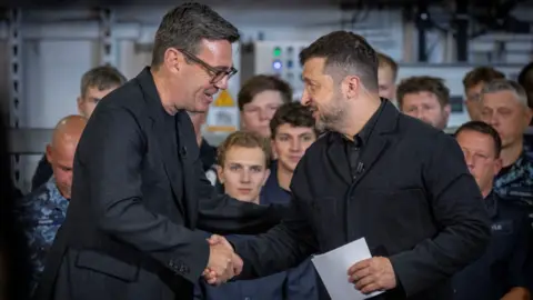 British Prime Minister Andy Burnham shaking hands with the President of Ukraine, Volodymyr Zelenskiy