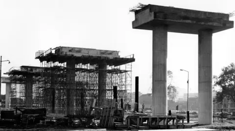 Scottish Roads Archive A black and white old fashioned photos showing two motorway columns being constructed. 