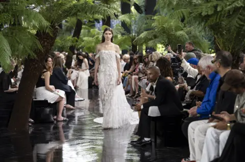 Victor VIRGILE/Gamma-Rapho via Getty Image A model walks the runway during the Christian Dior Haute Couture Fall/Winter 2026-2027 fashion show as part of Paris Fashion Week on July 06, 2025 in Paris, France. 