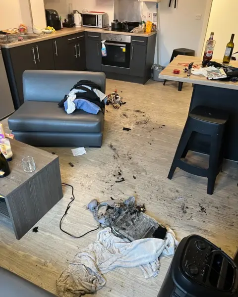 Leicestershire Fire & Rescue A kitchen with a burnt out portable heater on the floor with a towel next to it.