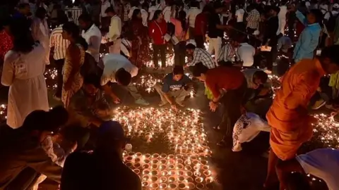 People light many candles