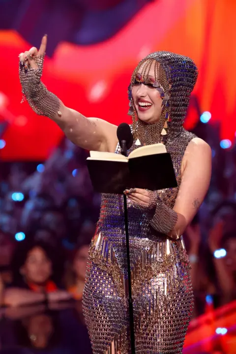 Getty Images Chappell Roan accepts the champion  caller   creator  prize astatine  the 2024 MTV VMAs