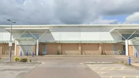 An empty TK Maxx store at York’s Monks Cross Shopping Park, with shutters down at the entrances. 
