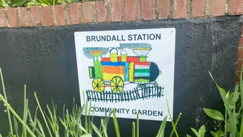 Greater Anglia Brundall station community garden sign